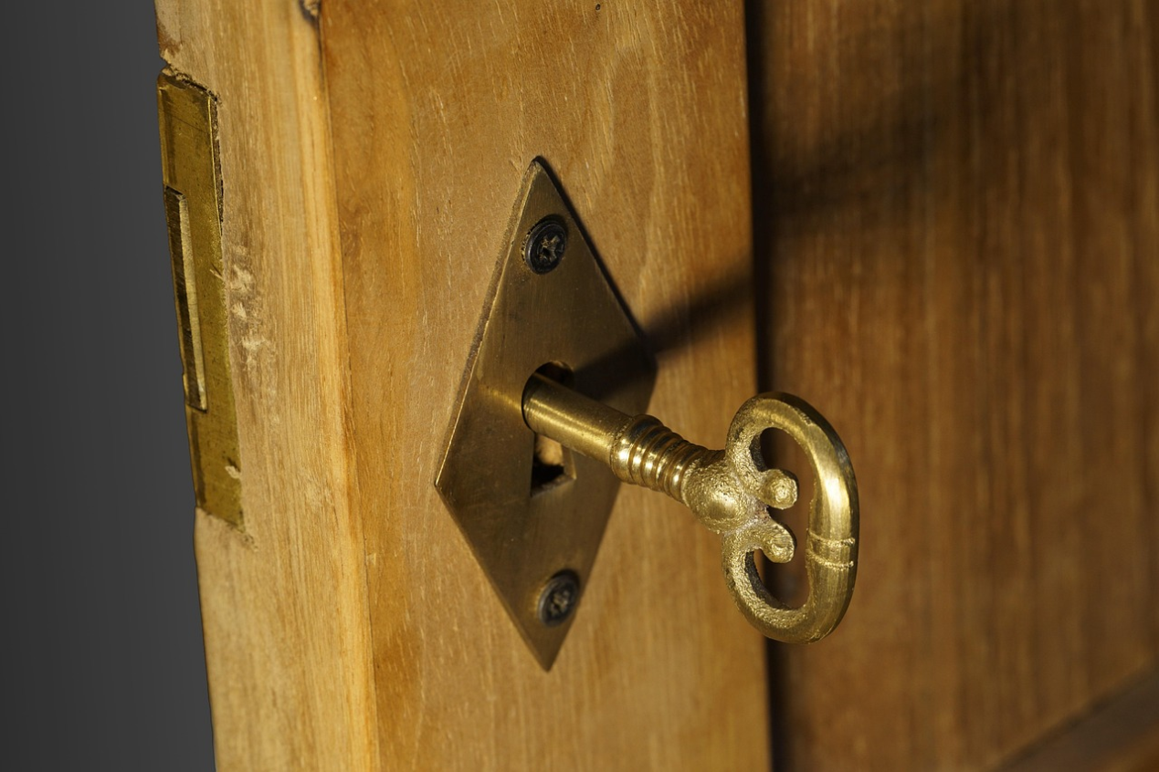 Close-up of a key stuck in a residential door lock