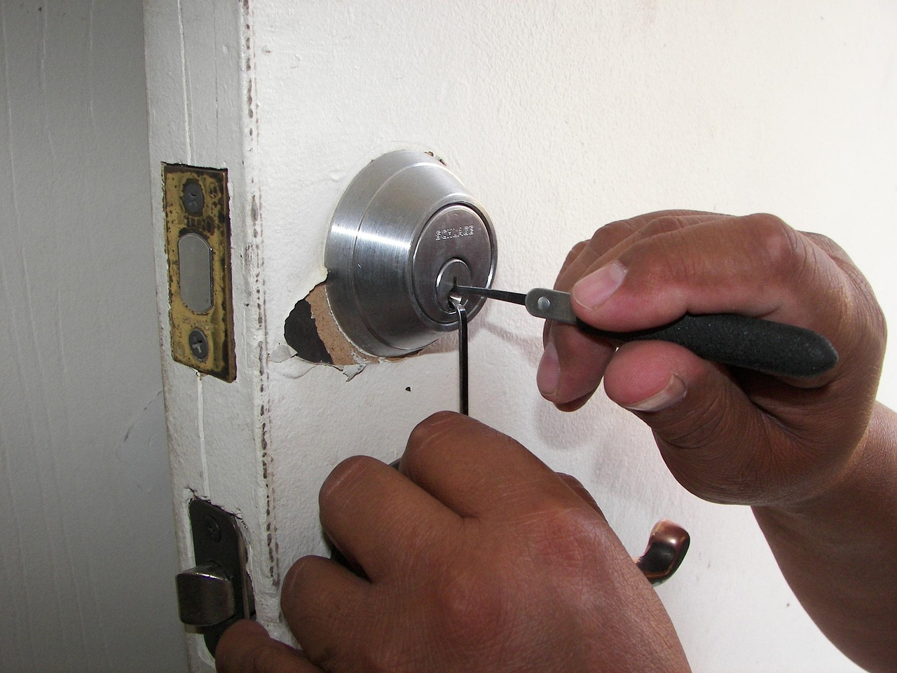Demonstration of how lock bumping works using a bump key and standard door lock