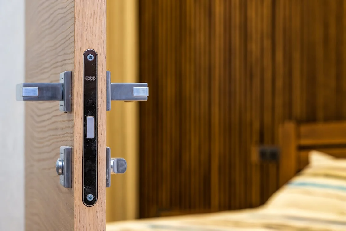 Modern upgraded door handle and secure lock installed on a bedroom door