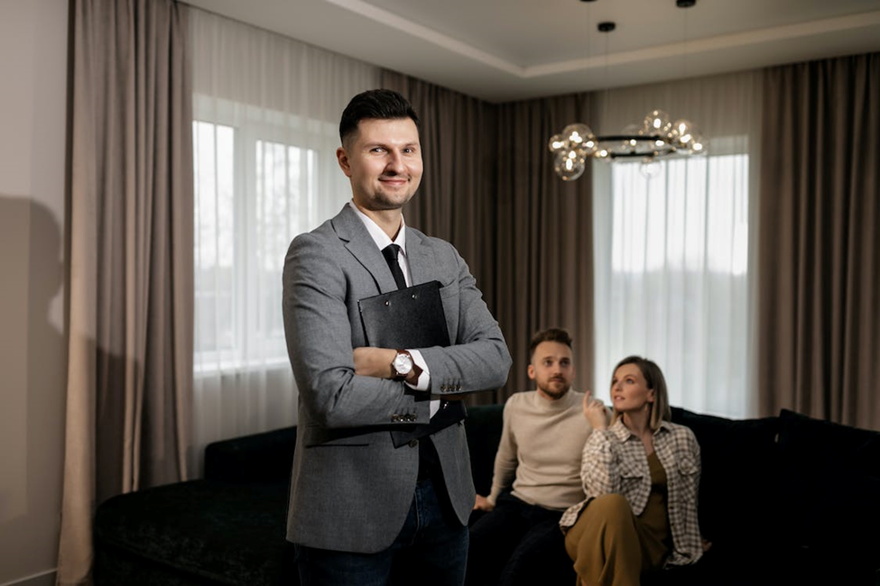 Happy couple sitting comfortably in a new home after a locksmith installed an upgraded lock.